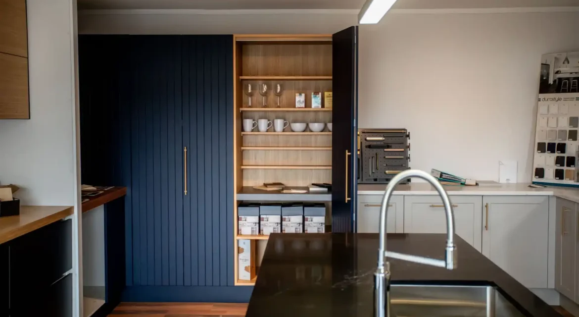 Designer kitchens Wellington homeowners love featuring natural timber cabinetry and stone benchtops by Chatswood Kitchens