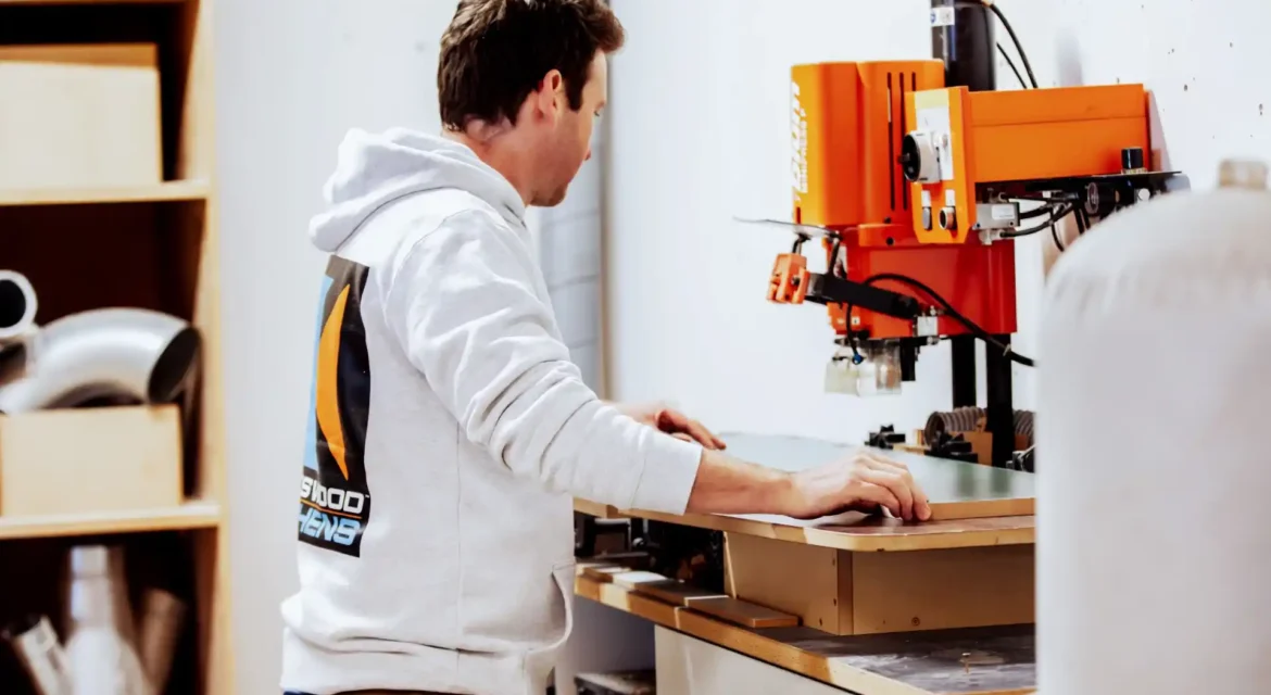 Contemporary kitchen design in Kapiti home with earthy tones and textured surfaces showcasing 2024 design trends