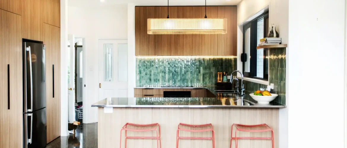 Contemporary kitchen layout design in Wellington home featuring island bench and optimised work zones for efficient meal preparation
