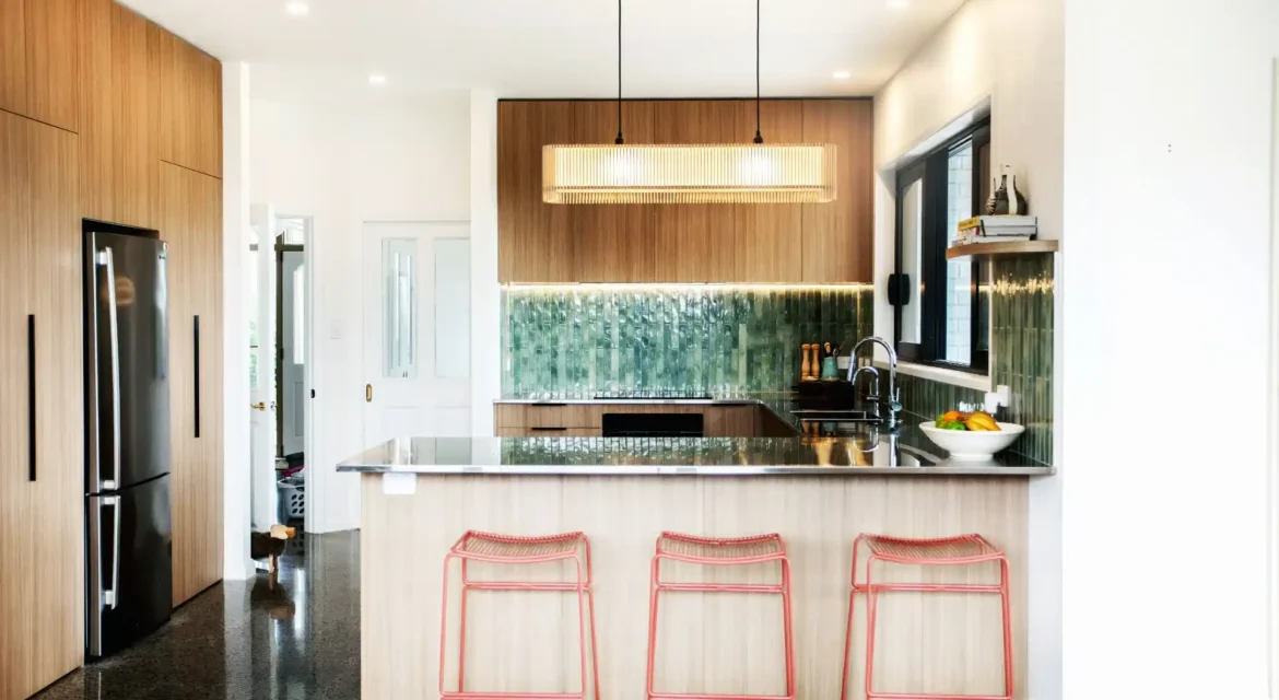 Contemporary kitchen layout design in Wellington home featuring island bench and optimised work zones for efficient meal preparation