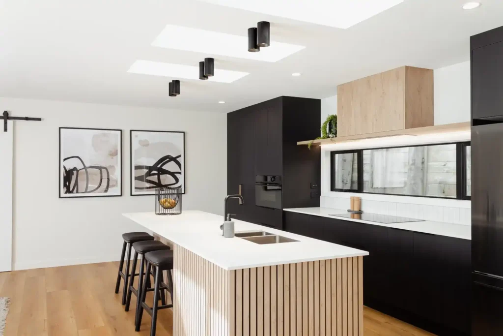 Custom kitchen design Paekakariki bungalow renovation featuring warm timber tones and Kapiti Island coastal views